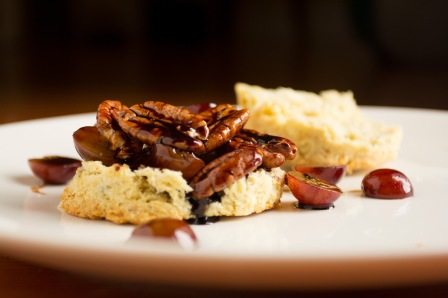 Bleu Cheese Biscuit with pecan halves and red grape in balsamic reduction